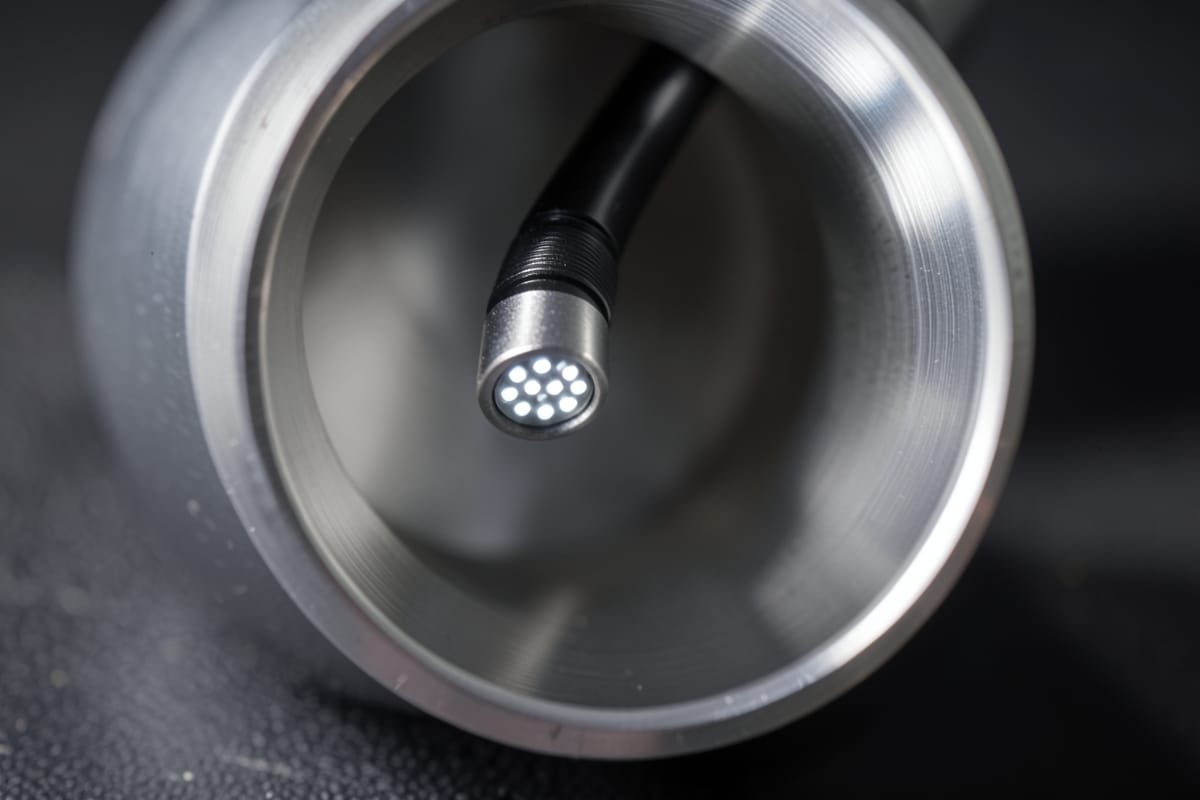 Articulating borescope tip bent inside an engine cylinder